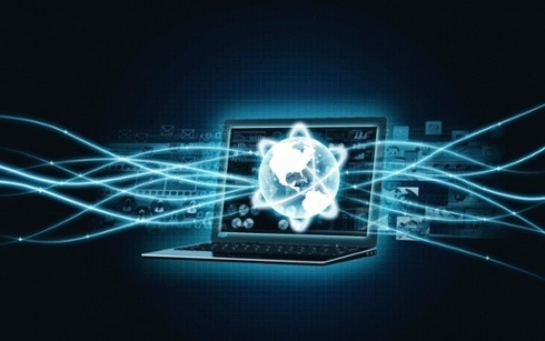 a laptop with a globe and lines of light coming out of it